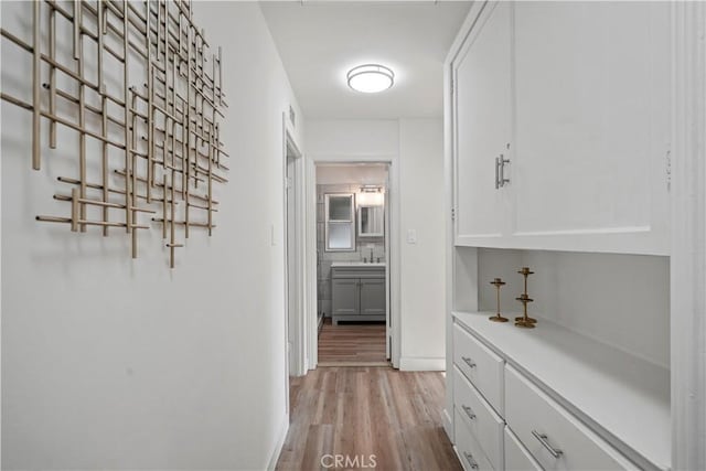 5616 Buffalo Ave, Valley Glen, CA 91401 - corridor with light wood-type flooring and baseboards