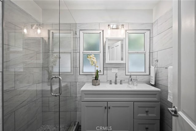 5616 Buffalo Ave, Valley Glen, CA 91401 - bathroom with vanity, a stall shower, and tile walls