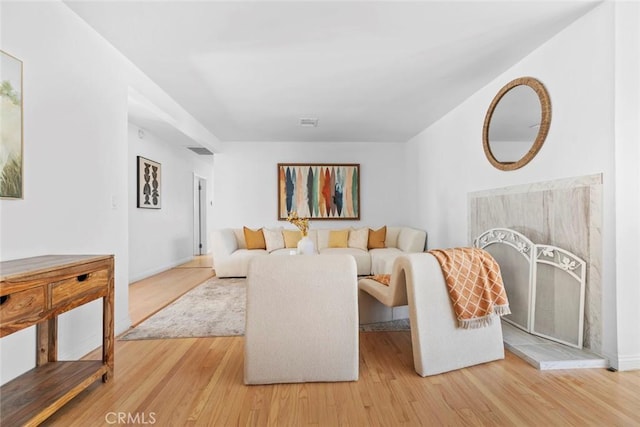 6454 Baird Ave, Reseda, CA 91335 - living room with light wood-style flooring and baseboards