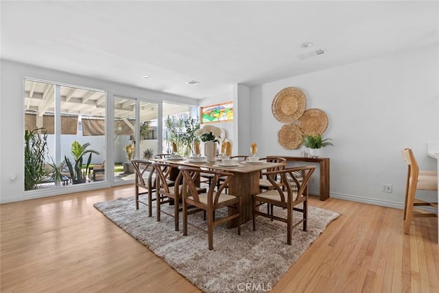 6454 Baird Ave, Reseda, CA 91335 - dining space featuring light wood-type flooring and baseboards