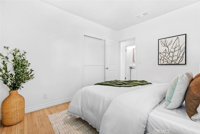 6454 Baird Ave, Reseda, CA 91335 - bedroom with light wood-type flooring, baseboards, and a closet