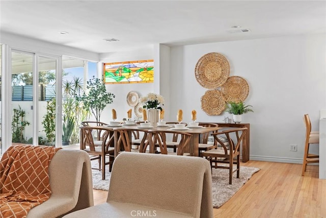 6454 Baird Ave, Reseda, CA 91335 - dining space with light wood-style flooring and baseboards