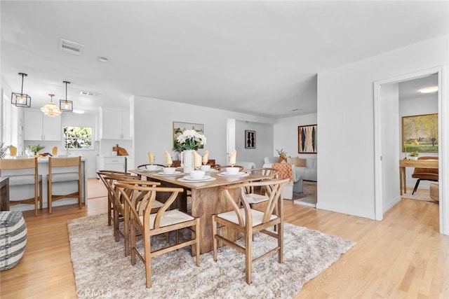 6454 Baird Ave, Reseda, CA 91335 - dining area featuring light wood-type flooring and baseboards