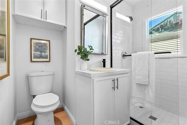6454 Baird Ave, Reseda, CA 91335 - bathroom with a shower stall, toilet, vanity, wood finished floors, and baseboards