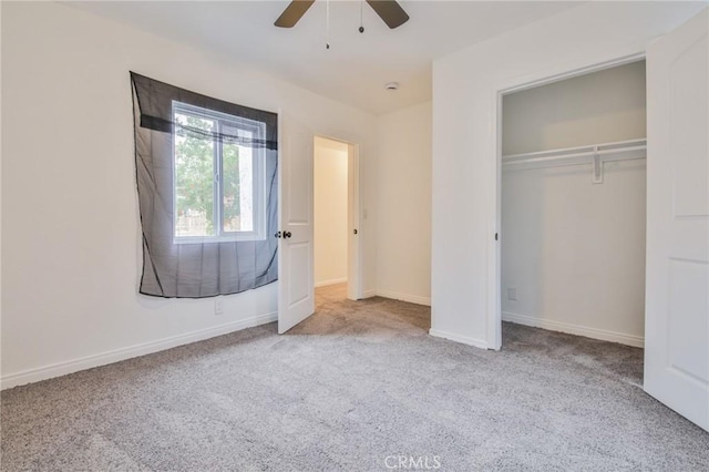 343 E 98th St, Los Angeles, CA 90003 - unfurnished bedroom featuring carpet flooring, a closet, a ceiling fan, and baseboards