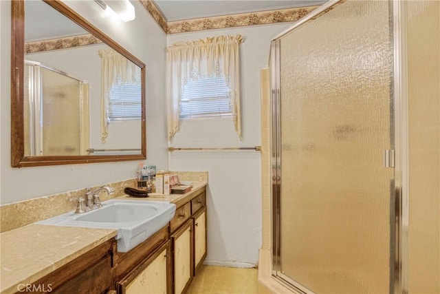 full bathroom featuring a shower stall and vanity