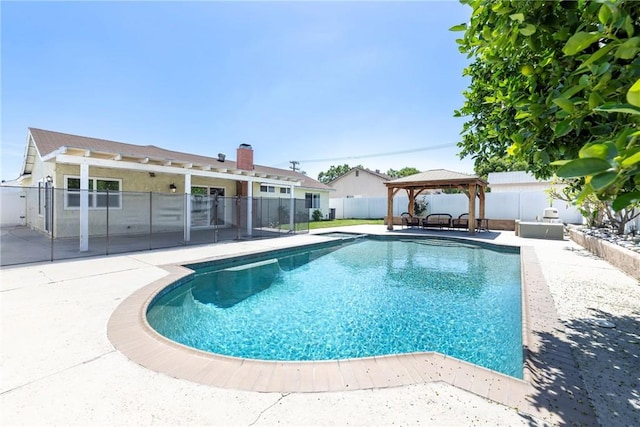 view of swimming pool with a gazebo, a patio area, and a fenced backyard