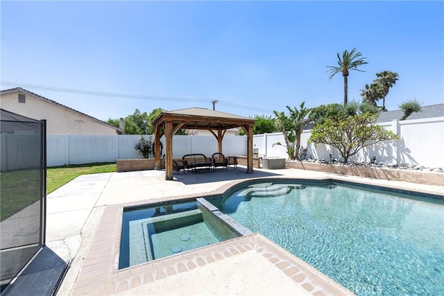 view of pool featuring a patio area, a gazebo, a fenced backyard, and a pool with connected hot tub