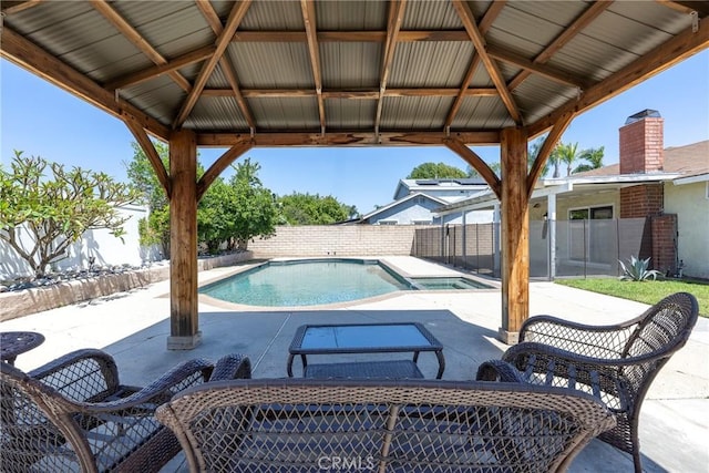 view of swimming pool featuring a gazebo, a patio area, and a fenced backyard