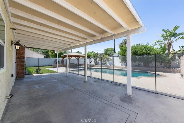 view of patio featuring a gazebo and a fenced backyard