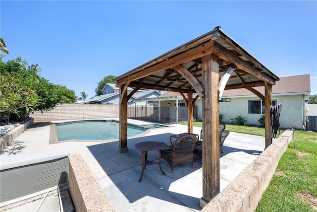 view of pool with a gazebo, a patio, and central AC