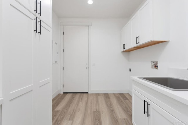 239 Futurity Ln, Fallbrook, CA 92028 - washroom with light wood finished floors, washer hookup, cabinet space, hookup for an electric dryer, and recessed lighting