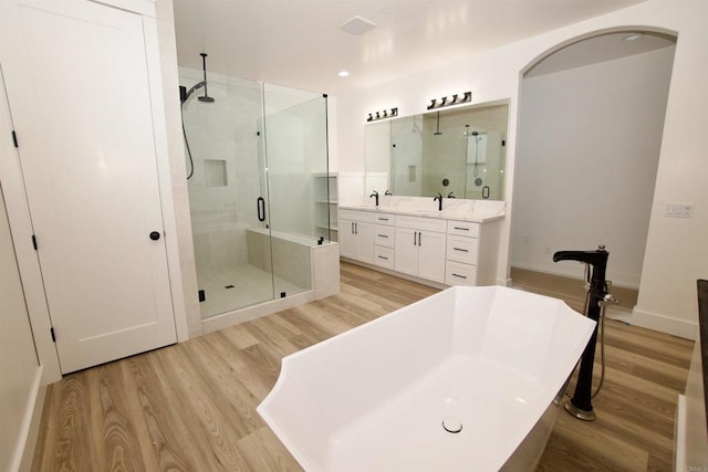 239 Futurity Ln, Fallbrook, CA 92028 - bathroom with a stall shower, a soaking tub, wood finished floors, and vanity