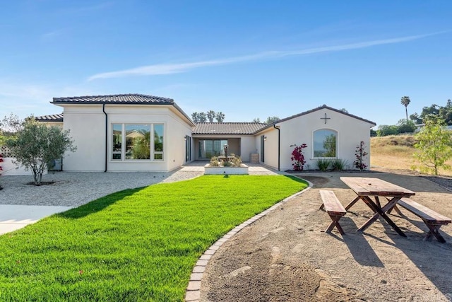 239 Futurity Ln, Fallbrook, CA 92028 - rear view of house featuring a tiled roof, stucco siding, and a lawn
