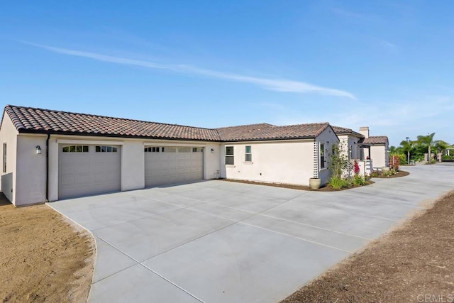 239 Futurity Ln, Fallbrook, CA 92028 - mediterranean / spanish-style home featuring driveway, a tiled roof, stucco siding, and a garage