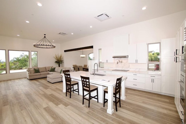 239 Futurity Ln, Fallbrook, CA 92028 - dining room featuring light wood-type flooring, recessed lighting, and a chandelier