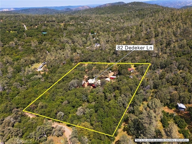 82 Dedeker Ln, Oroville, CA 95966 - aerial view of property's location featuring a heavily wooded area, property parcel outlined, and mountains