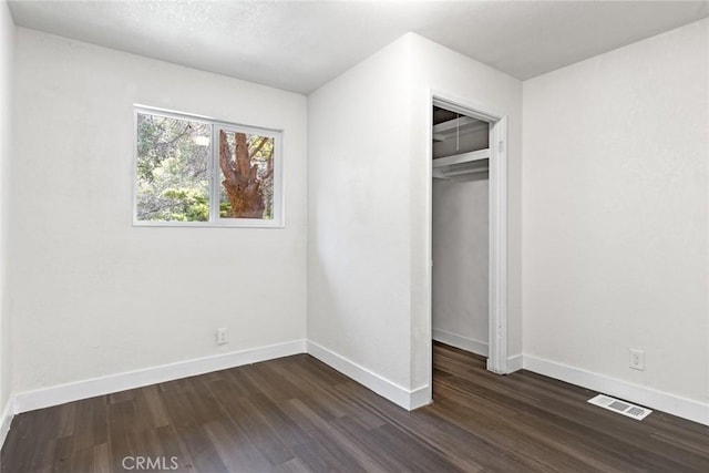 82 Dedeker Ln, Oroville, CA 95966 - unfurnished bedroom with dark wood-style flooring, baseboards, and a closet