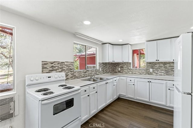 82 Dedeker Ln, Oroville, CA 95966 - kitchen featuring white appliances, a sink, light countertops, white cabinetry, and backsplash