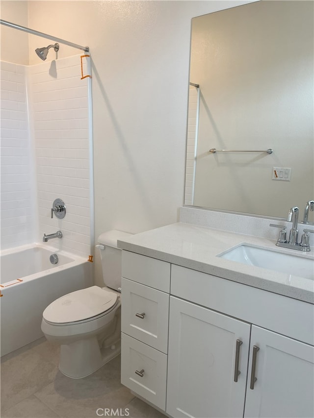 bathroom with toilet, vanity, shower / washtub combination, and tile patterned floors