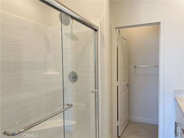 full bath with a shower stall