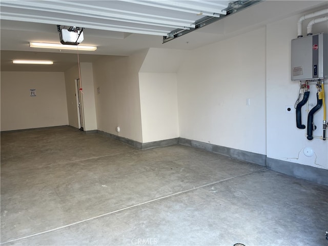 garage with a garage door opener and water heater