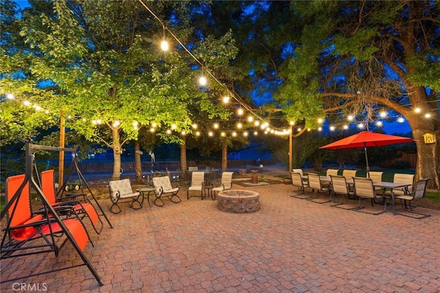 63 Our Way, Chico, CA 95973 - patio at twilight featuring a fire pit and a patio area