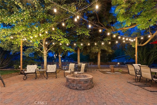 63 Our Way, Chico, CA 95973 - patio at night featuring a patio and a fire pit