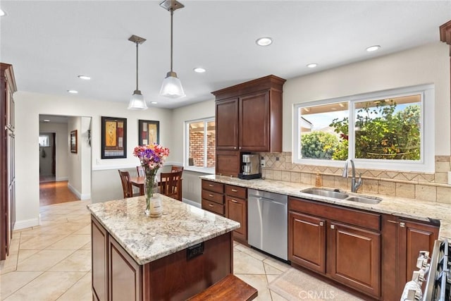 63 Our Way, Chico, CA 95973 - kitchen featuring a sink, stainless steel dishwasher, tasteful backsplash, a center island, and light tile patterned floors