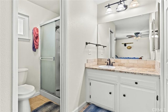 63 Our Way, Chico, CA 95973 - bathroom with toilet, a shower stall, tile patterned flooring, vanity, and a ceiling fan