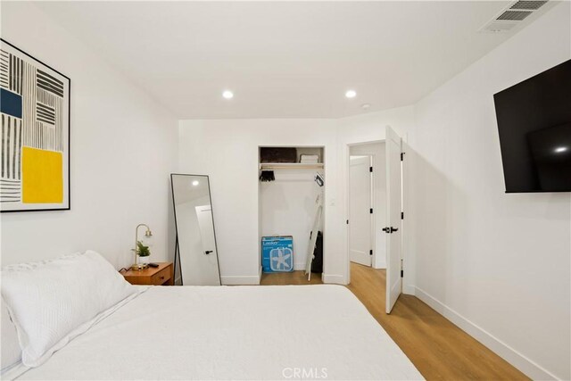 6916 Etiwanda Ave, Reseda, CA 91335 - bedroom featuring wood finished floors, recessed lighting, a closet, and baseboards