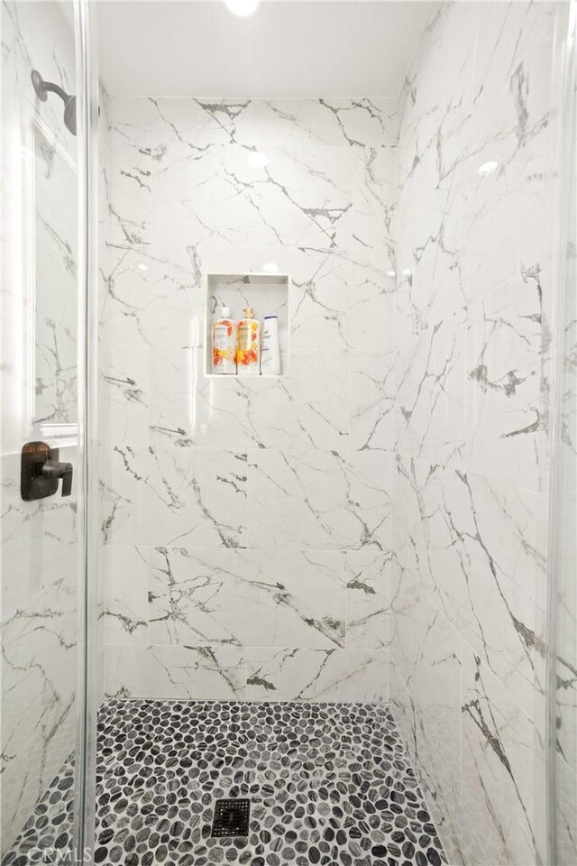 6916 Etiwanda Ave, Reseda, CA 91335 - bathroom featuring a marble finish shower