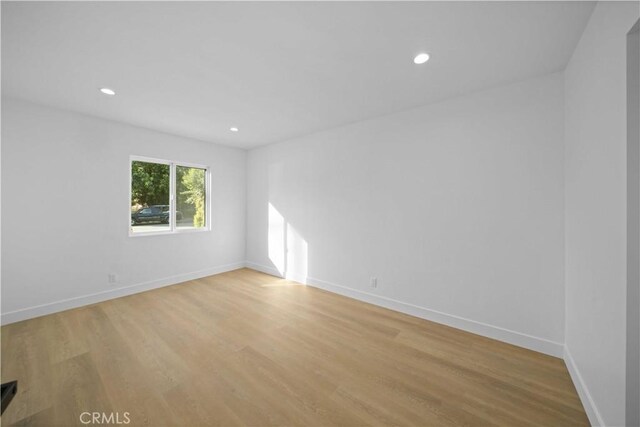 6916 Etiwanda Ave, Reseda, CA 91335 - spare room with light wood-style floors, baseboards, and recessed lighting