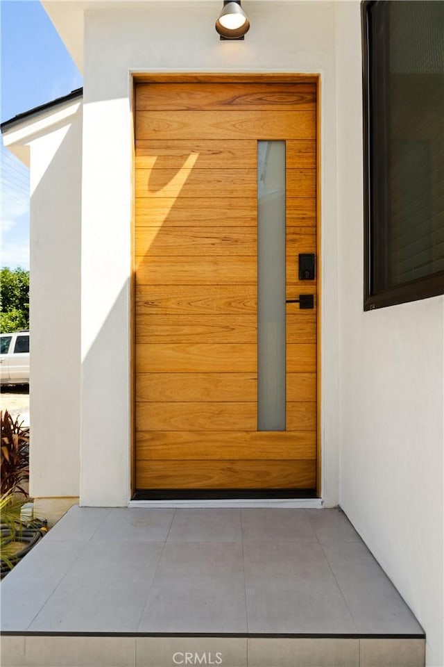 6916 Etiwanda Ave, Reseda, CA 91335 - doorway to property featuring stucco siding