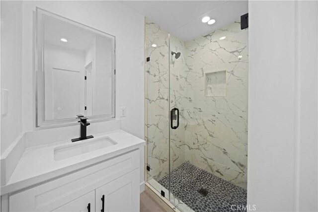 6916 Etiwanda Ave, Reseda, CA 91335 - bathroom with a marble finish shower, vanity, and recessed lighting