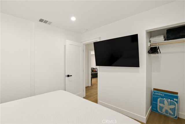 6916 Etiwanda Ave, Reseda, CA 91335 - bedroom with wood finished floors, recessed lighting, and baseboards