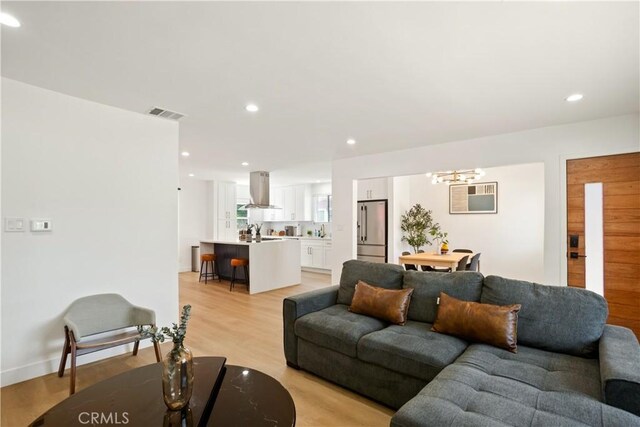 6916 Etiwanda Ave, Reseda, CA 91335 - living area featuring a chandelier, light wood-style floors, and recessed lighting