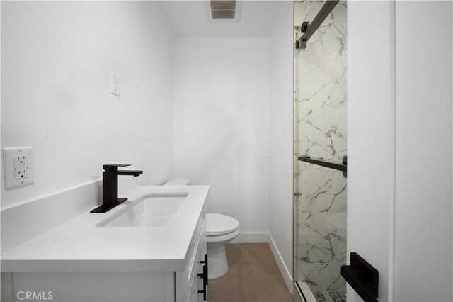 6916 Etiwanda Ave, Reseda, CA 91335 - bathroom with vanity, a marble finish shower, toilet, and baseboards