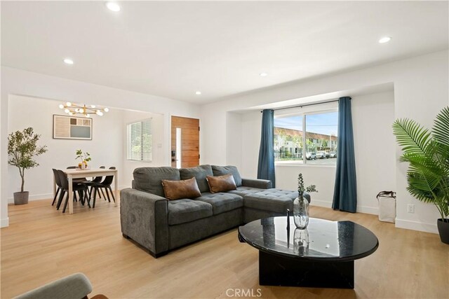6916 Etiwanda Ave, Reseda, CA 91335 - living area with a chandelier, light wood finished floors, recessed lighting, and baseboards