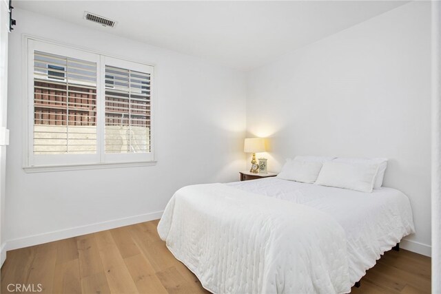 35987 Corte Renata, Murrieta, CA 92562 - bedroom with baseboards and wood finished floors