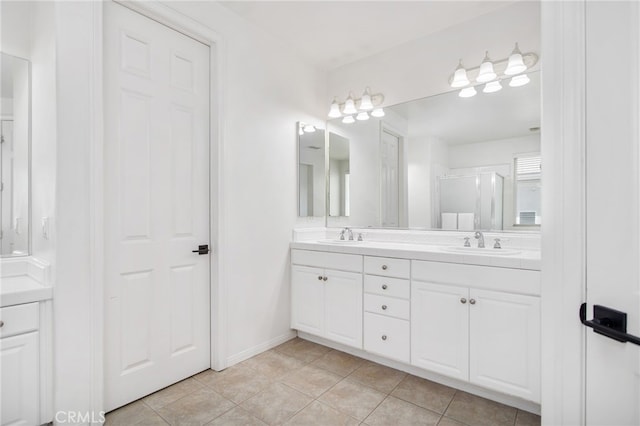 35987 Corte Renata, Murrieta, CA 92562 - bathroom with double vanity, a shower stall, tile patterned flooring, and baseboards