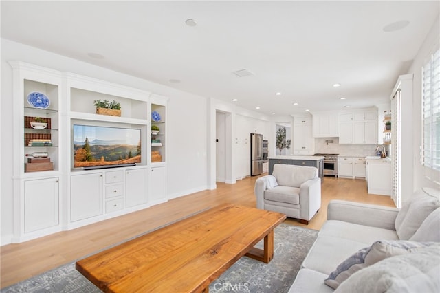 35987 Corte Renata, Murrieta, CA 92562 - living room with light wood finished floors, healthy amount of natural light, and recessed lighting