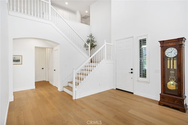35987 Corte Renata, Murrieta, CA 92562 - entryway featuring a towering ceiling, stairway, light wood-style floors, baseboards, and recessed lighting