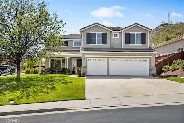 35987 Corte Renata, Murrieta, CA 92562 - view of front of home featuring a garage, concrete driveway, a tiled roof, and stucco siding