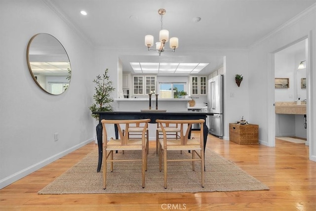 1006 Palm Ln, Redondo Beach, CA 90278 - dining space featuring a chandelier, light wood-type flooring, baseboards, ornamental molding, and recessed lighting