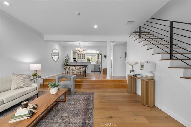 1006 Palm Ln, Redondo Beach, CA 90278 - living room with light wood-style flooring, ornamental molding, recessed lighting, baseboards, and a chandelier