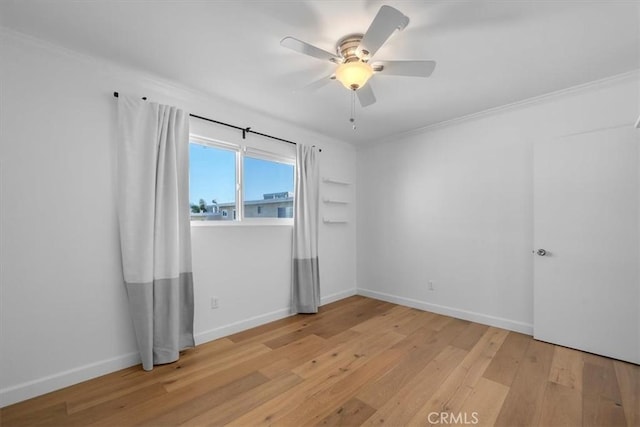 1006 Palm Ln, Redondo Beach, CA 90278 - unfurnished room featuring light wood-style floors, baseboards, ceiling fan, and ornamental molding