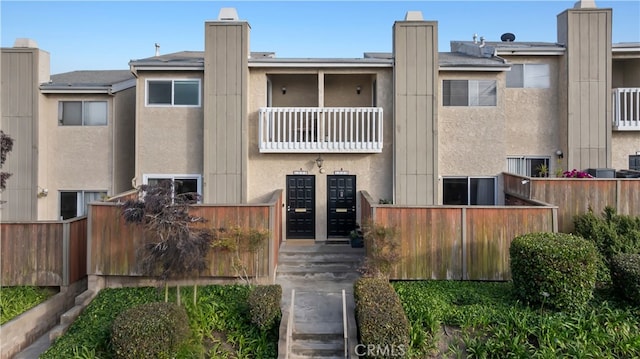 1006 Palm Ln, Redondo Beach, CA 90278 - back of house with a balcony and stucco siding