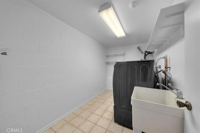 1006 Palm Ln, Redondo Beach, CA 90278 - laundry area with washer / clothes dryer, light tile patterned flooring, and concrete block wall