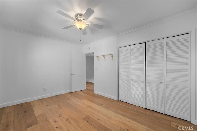 1006 Palm Ln, Redondo Beach, CA 90278 - unfurnished bedroom with ornamental molding, light wood-style flooring, baseboards, a closet, and a ceiling fan